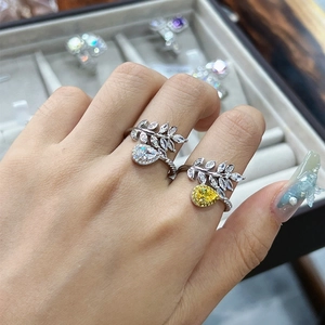Leaf shaped 925 silver ring with pear cut cubic zirconia on female hand for women