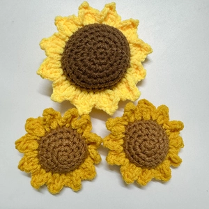 Detailed macro view of handmade crochet sunflower petals with intricate yarn texture