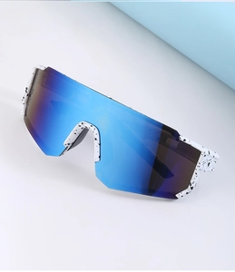 Detail of white splash-patterned frame and blue multilayer coated lens for cycling sunglasses