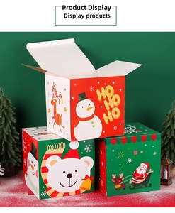 Three stacked Christmas gift boxes with cartoon snowman and reindeer patterns in snow scene