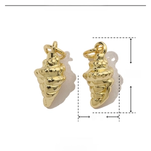 Macro detail of a 16x6mm shell-shaped gold copper pendant for DIY jewelry making
