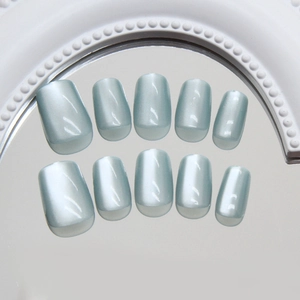 Short square emerald green cat-eye press-on nails with reflective mirror finish