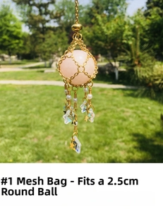 Detailed view of golden mesh pouch pendant for 2.5cm crystals with star charms