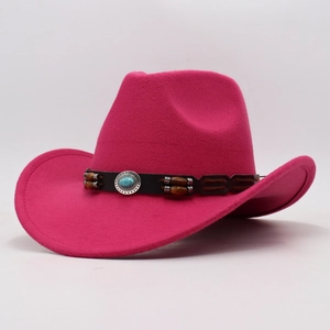Detail of rose red felt cowboy hat featuring a turquoise stone and dark brown band