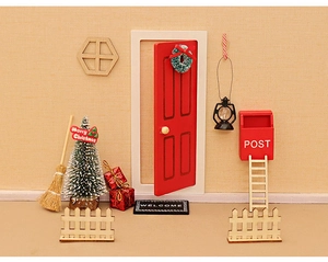 Miniature Christmas dollhouse set with red door, tiny tree, mailbox, and festive accessories