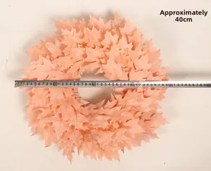 Detail showing the 40cm diameter measurement of a pink artificial Christmas wreath