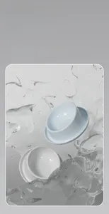 Detail of smooth ceramic pet bowls with wide anti-spill tray in minimalist water splash