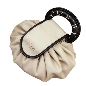 Waterproof cream makeup bag with black handles and elegant cloud pleated design