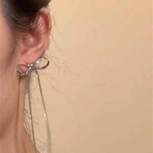 Silver bowknot tassel drop earrings featuring long chains for a stylish minimalist look