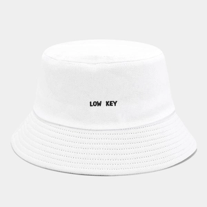 White cotton bucket hat with black LOW KEY embroidery and reinforced stitching brim