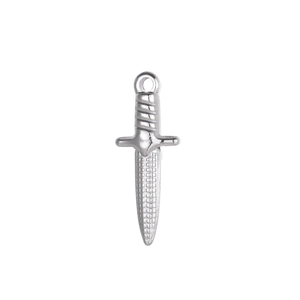 Detailed macro view of vintage stainless steel dagger pendant with engraved textures