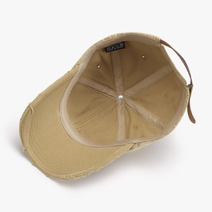 Beige washed distressed baseball cap in 100% cotton with vintage ripped brim effect