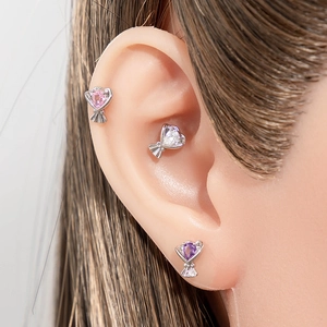 Titanium steel bouquet earrings with colorful heart zircon crystals on ear model