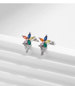 Macro shot of 925 sterling silver flower earrings with colorful marquise-cut zircons