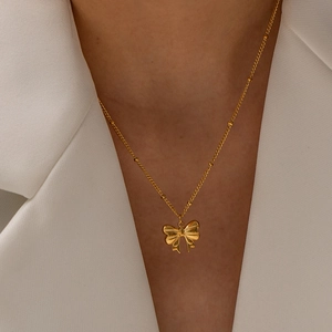 Detail of 18K gold stainless steel bead chain necklace with butterfly pendant on model