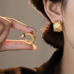 Textured gold geometric C-shaped hoop earrings with vintage hammered metal finish