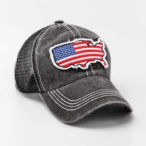 Macro detail of USA map flag embroidery on vintage washed grey trucker baseball cap