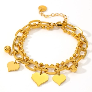Double-layered gold stainless steel bracelet with pixel heart and ball charms on white background