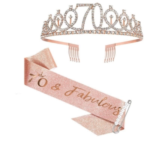 Close-up of rose gold 70th birthday set including rhinestone crown and glitter sash