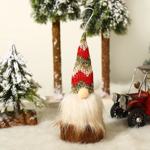 Christmas gnome ornament with red knit hat, white beard, and wooden base for tree decor