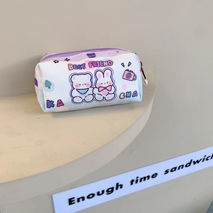 Detail of cute canvas pencil case showing bear bunny graphics and zipper texture