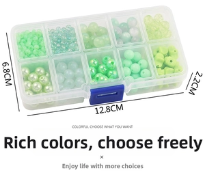 Macro view of 10-compartment storage box with green glass beads and 12.8cm dimensions