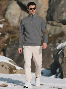Close-up of gray knit sweater featuring a buttoned high collar and brown suede elbow patches