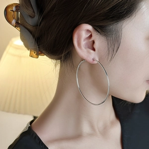 Minimalist silver large hoop earrings for women with polished metallic mirror finish