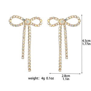 Detailed view of sparkling bow earrings with rhinestones and measurement annotations