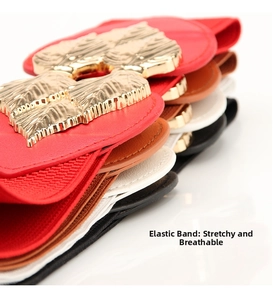 Close-up of elastic waist belts in multiple colors with ornate golden lion head buckles