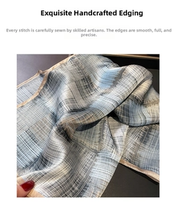 Close-up of premium silk scarf featuring delicate hand-rolled edges and artistic plaid pattern