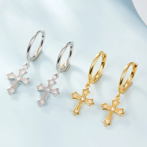 Close-up of S925 silver and gold cross hoop earrings with sparkling zircon stones