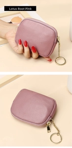 Detail of lotus root pink leather coin purse with lychee texture and golden keychain