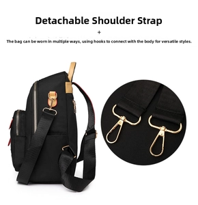 Detail of detachable shoulder strap with golden metal hook for versatile carrying styles