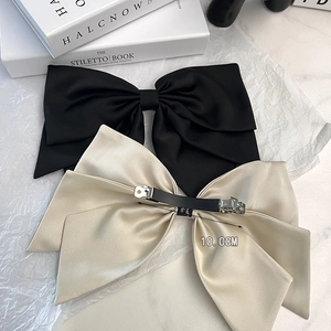 Elegant satin bow hair clips in black and beige with 10cm metal spring clips