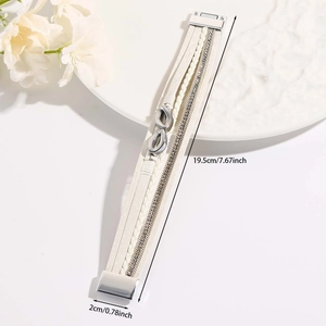 Detail of white multilayer leather bracelet with infinity charm and magnetic buckle