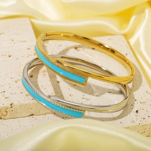 Minimalist 18K gold and silver plated stainless steel bangles with blue enamel inlay