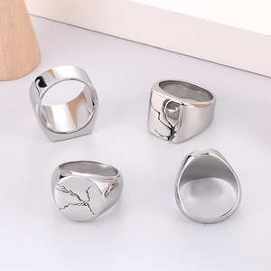 Set of men's stainless steel rings featuring vintage cracked textures and smooth finishes