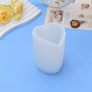 DIY long heart-shaped acrylic candle mold with translucent frosted texture on blue background