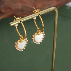 Elegant gold titanium earrings with heart mother of pearl and small pearl rose detail