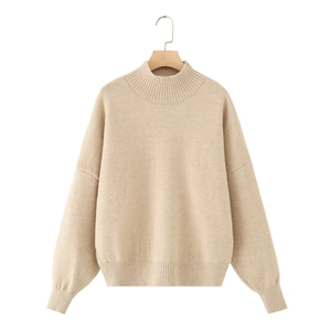 Soft beige knit sweater featuring a stand-up collar and ribbed cuffs in a relaxed fit