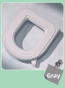 Detail of grey waterproof EVA toilet seat cover with BROUD logo and premium texture