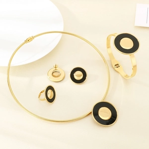 Luxurious gold and black stainless steel jewelry set including necklace, bracelet and ring