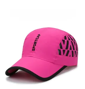 Detail of pink quick-dry baseball cap with black mesh side panels and SPORTCAP text