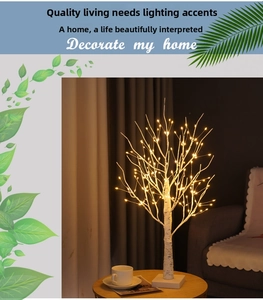Detail of birch LED tree lamp with warm yellow light beads and realistic bark texture