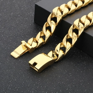Detailed macro view of 15mm gold Cuban link chain with secure box clasp closure