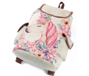 Detail view of unicorn and flower print canvas backpack with brown leather accents