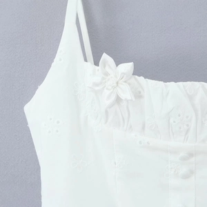 French style white dress with floral embroidery, silk flowers, and covered buttons detail