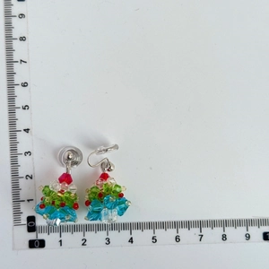Detailed view of handmade beaded Christmas tree earrings with ruler showing 2.5cm size