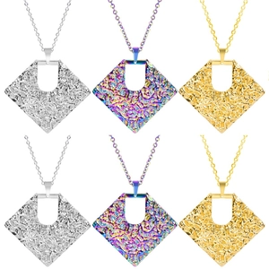 Detail of 18k plated geometric diamond necklaces in silver, gold, and colorful finishes